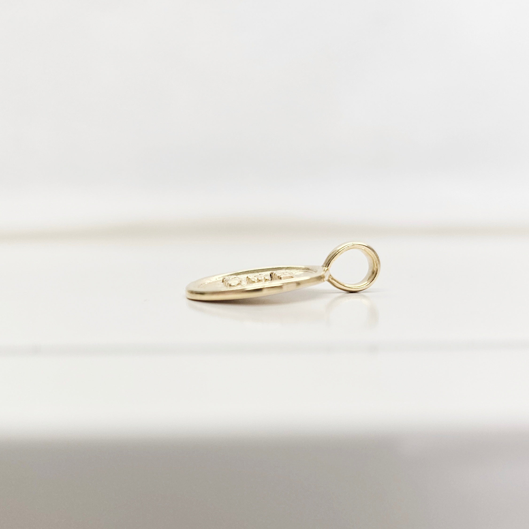 Side view to show thickness of necjklace charm pendant: Burn the Boats Motivational Charm Pendant Jewelry in Gold by Lat & Lo- Wax seal-Coin shaped jewelry-gift jewelry-inspiring necklace charm