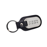 Picture of front view of black leather and stainless steel key chain that is custom inscribed with latitude longitude coordinates. By Lat & Lo. Available at latandlo.
