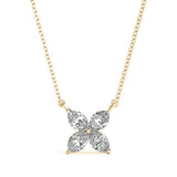 Diamond flower pendant on a gold chain against a white background