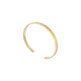 Gold bracelet on a white background
