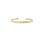 Gold bracelet with engraved coordinates on a white background