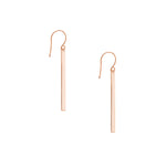 Rose gold bar earrings on a white background