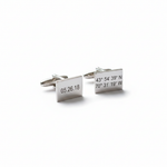 Pair of silver cufflinks on a white background