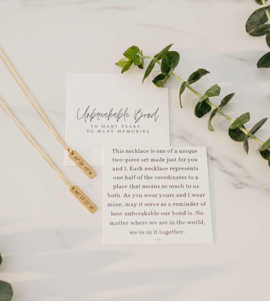 Friendship Necklace with a card on a marble surface with eucalyptus  leaves by Lat & Lo