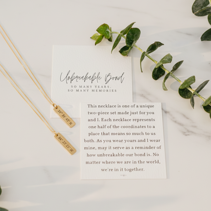 Friendship Necklace with a card on a marble surface with eucalyptus  leaves by Lat & Lo