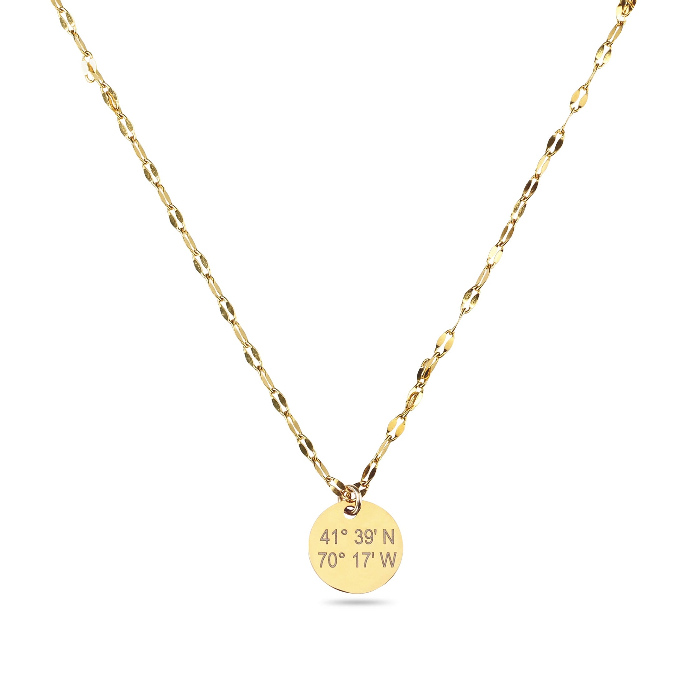 Gold necklace with a round pendant on a white background_engraved with coordinates