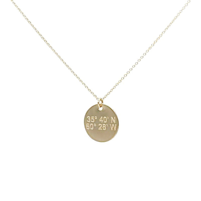 Lat & Lo disc necklace in 14K gold filled.  inscribed with custom coordinates.