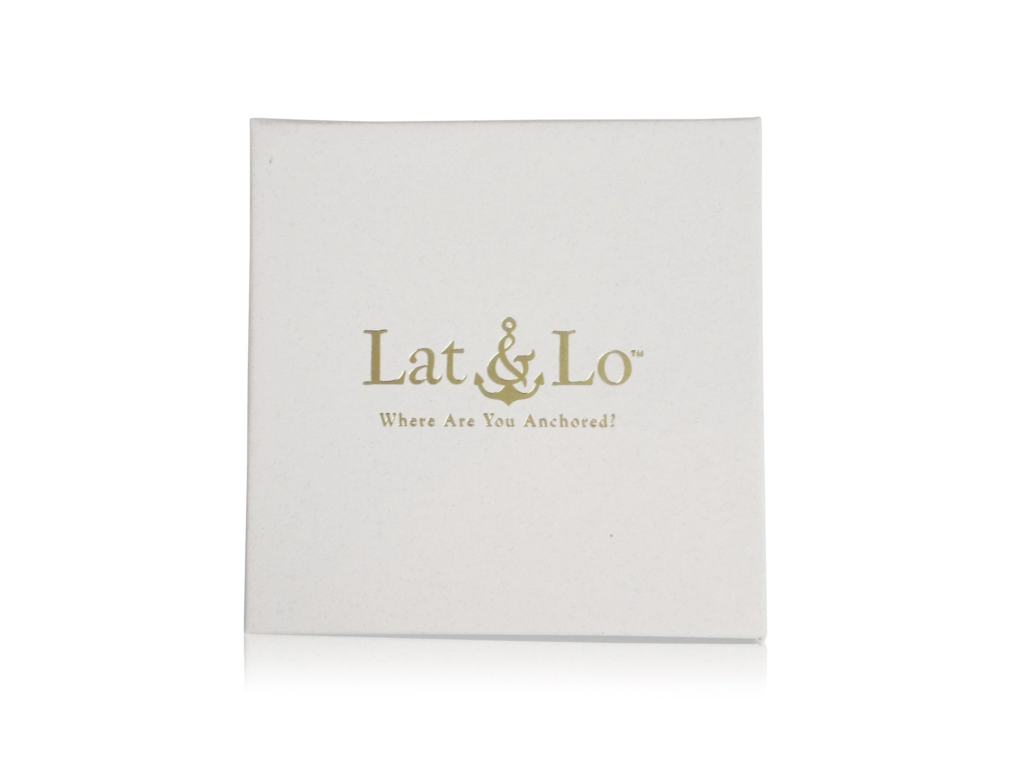 Lat & Lo Packaging, white box with gold logo seal