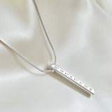Sterling Silver coordinates necklace on satin. Column pendant. By Lat & Lo.