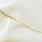 Lat & Lo Co-Captains bracelet laying flat, women's style, figaro chain, engraved with coordinates, gold vermeil