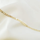 Lat & Lo Co-Captains bracelet laying flat, women's style, figaro chain, engraved with coordinates, gold vermeil