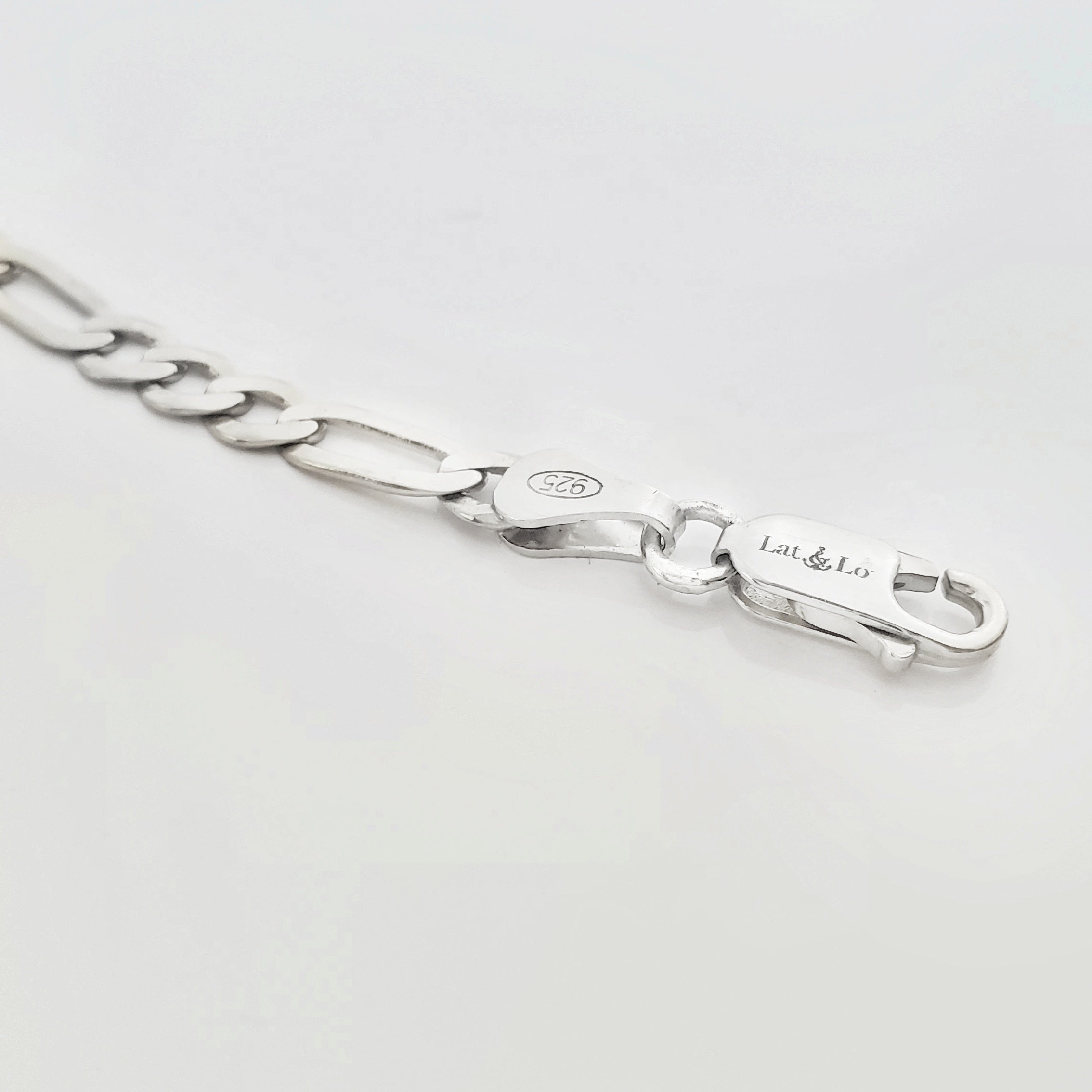 Lat & Lo Co-Captains bracelet, women's style, close up of lobster clasp and figaro chain, sterling silver