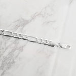 Lat & Lo, close up of figaro chain, captains bracelet, Italian silver