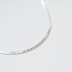 herringbone necklace with coordinates inscribed on it in sterling silver