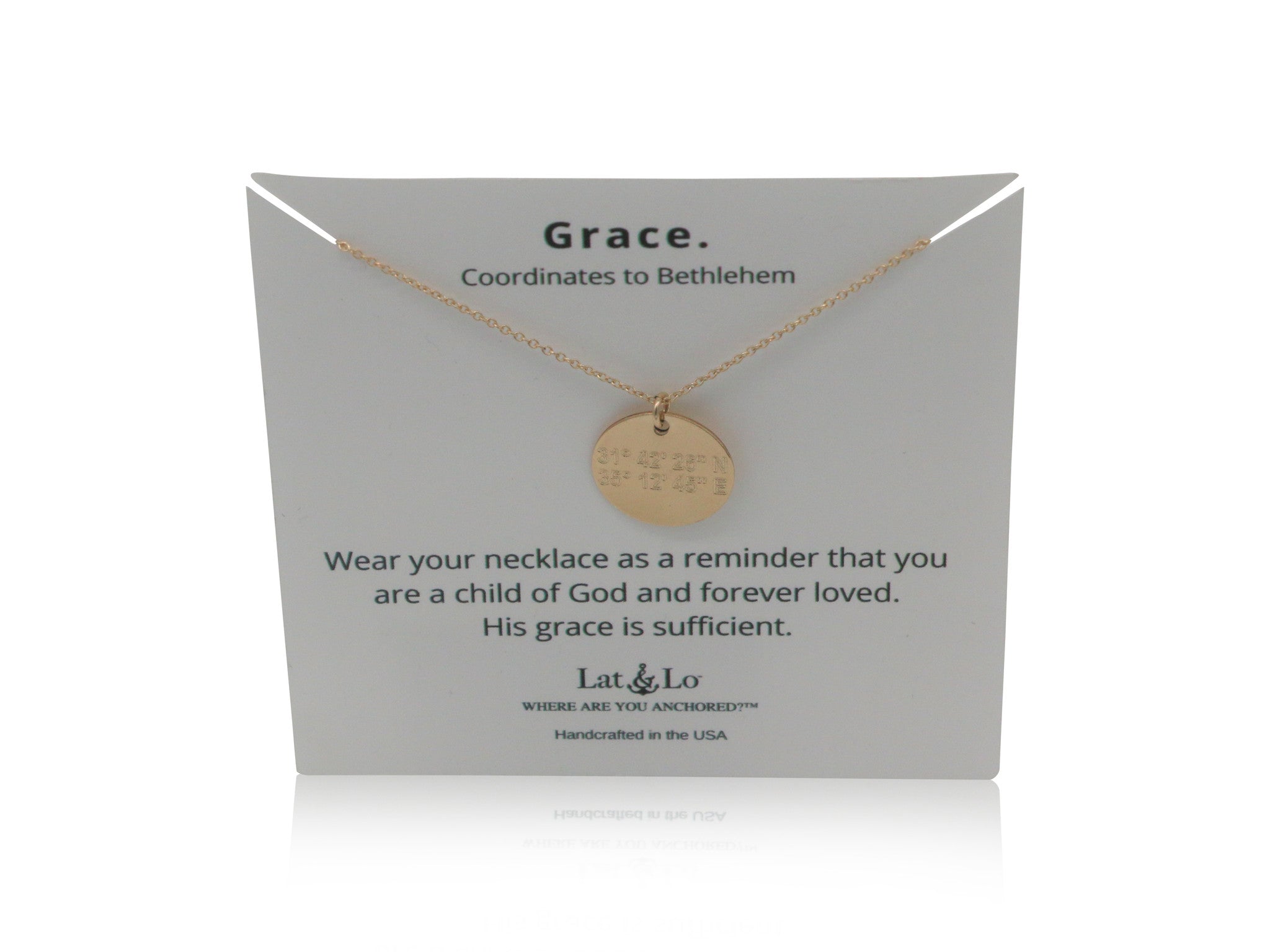 Lat & Lo Disc Necklace on a Grace display card, coordinates inscribed lead to Bethlehem, 14K gold filled