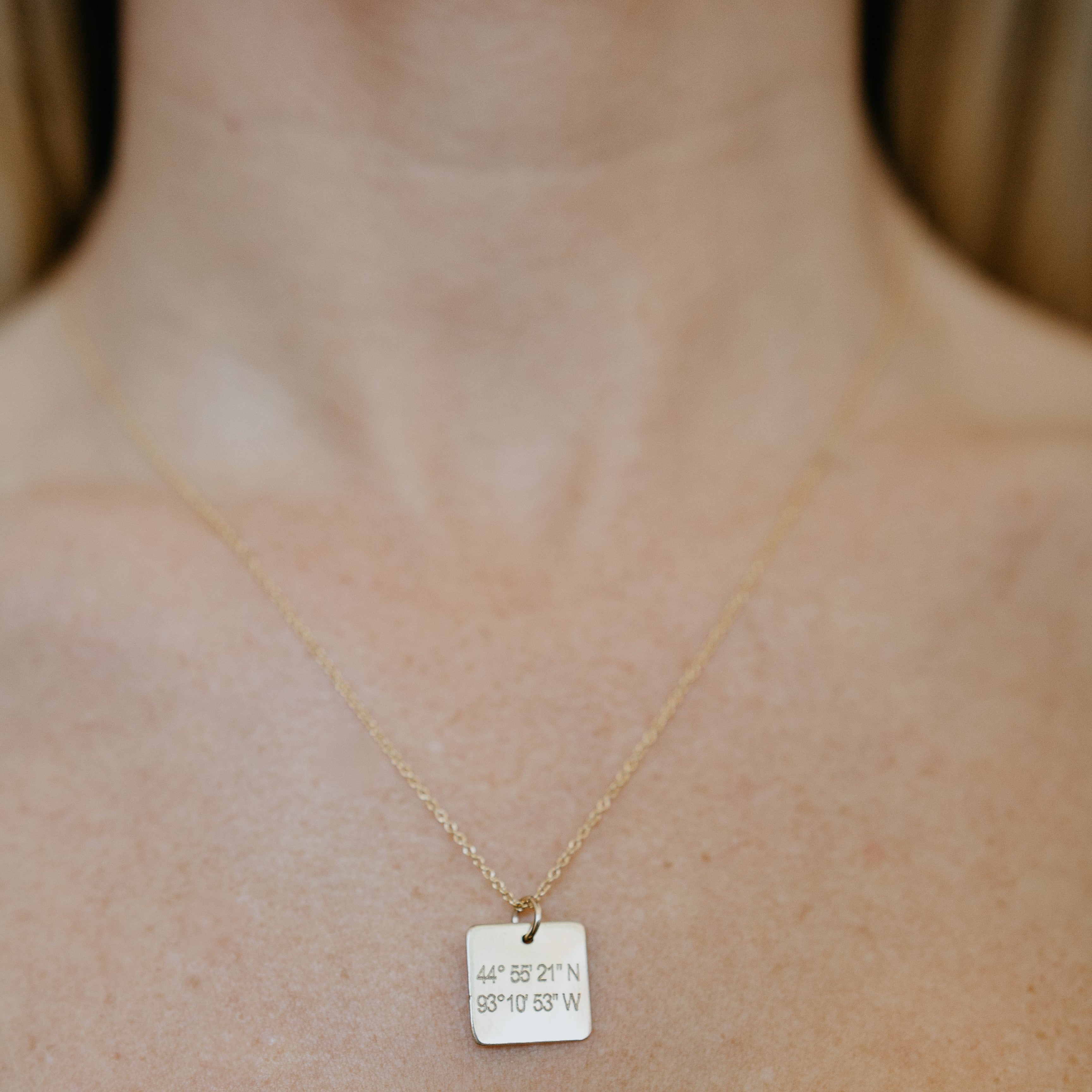 Lat & Lo Casco necklace, on figure, square charm on cable chain, engraved with coordinates, 14K gold filled