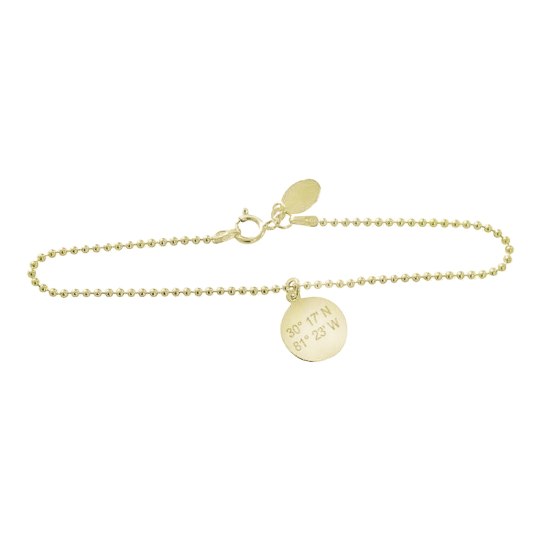 Bead chain bracelet with charm on it that is inscribed with latitude longitude coordinates. 14K Gold Filed.. By Lat & Lo.