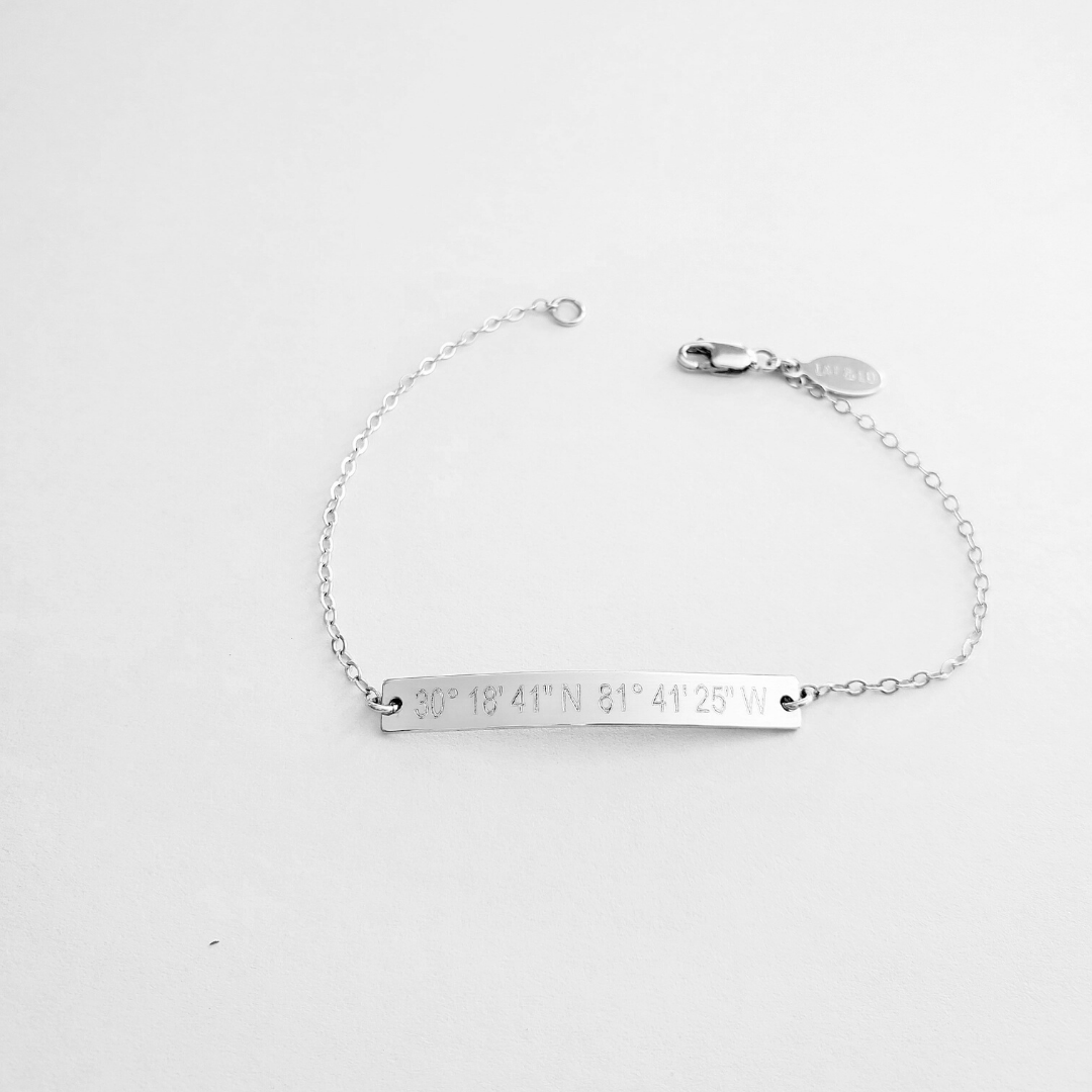 Coordinates skinny bar bracelet in silver color. .925 Sterling Silver. Latitude longitude bracelet by lat & lo.