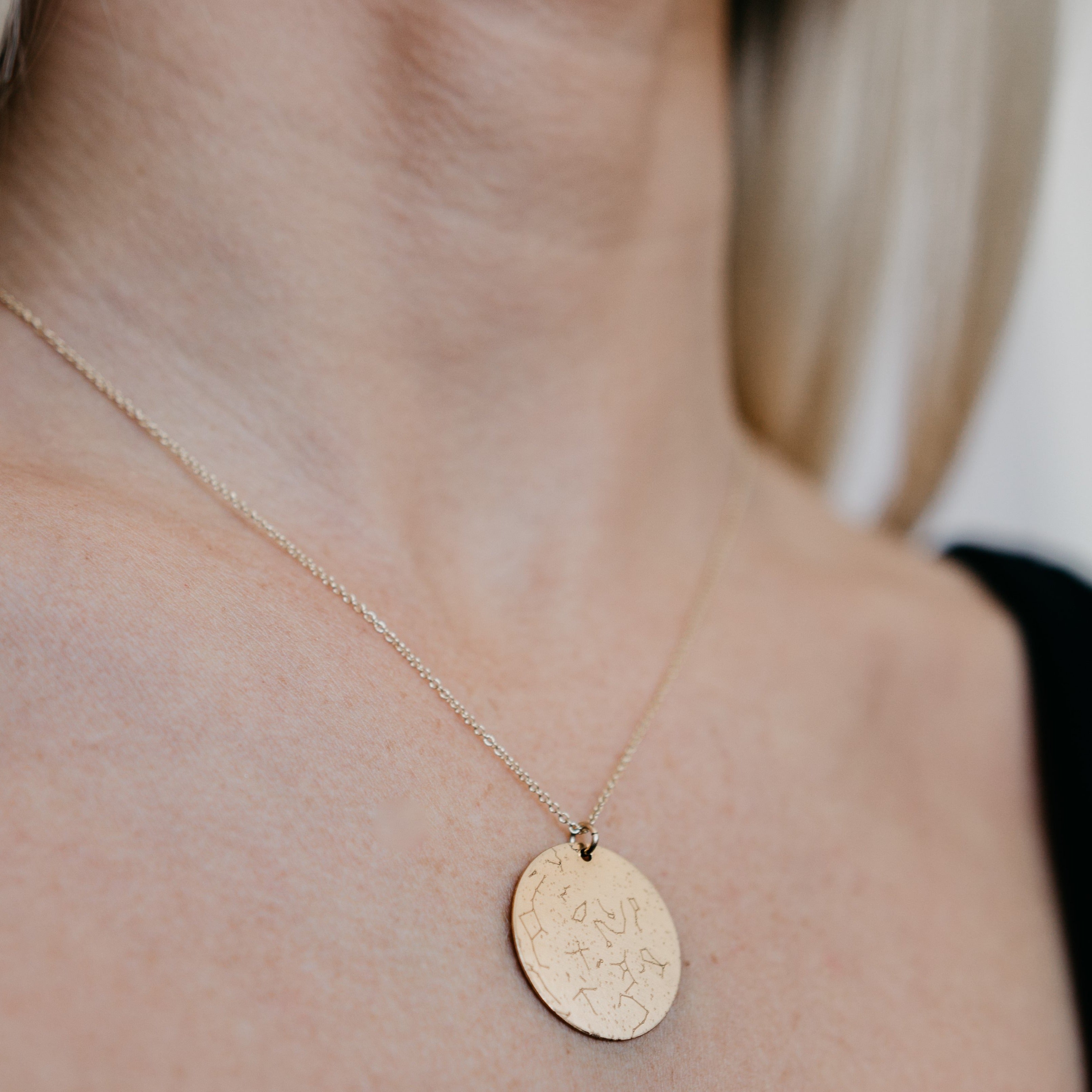 Lat & Lo star map necklace in 14K gold filled shown on models neck 