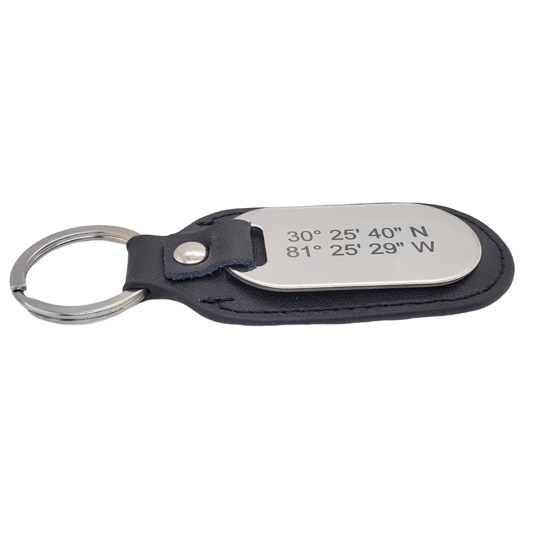 Picture of side view of black leather and stainless steel key chain that is custom inscribed with latitude longitude coordinates. By Lat & Lo. Available at latandlo.com