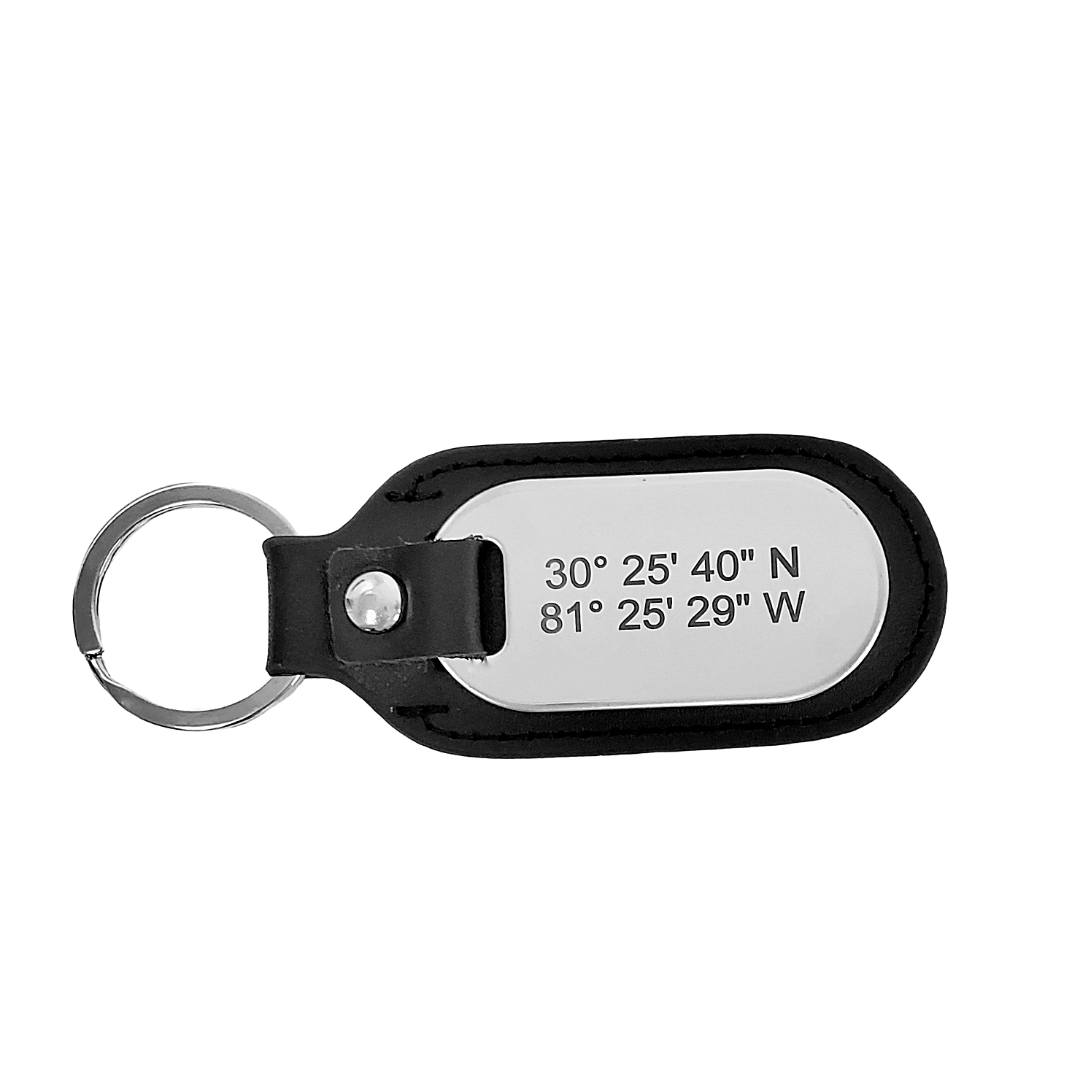 Picture of top view of black leather and stainless steel key chain that is custom inscribed with latitude longitude coordinates. By Lat & Lo. Available at latandlo.com